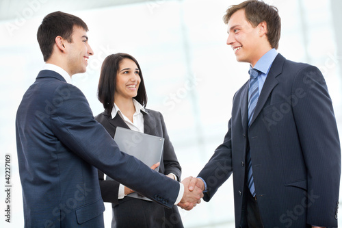Photo: Business people shaking hands Business people shaking hands