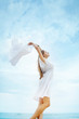 woman jumping with fabric