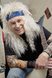 Portrait of hippie guitarist laughing