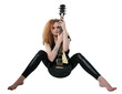 curly-haired girl sitting with a guitar