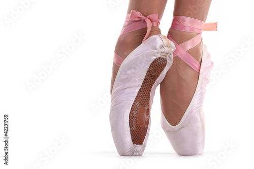 Photo: Closeup view of ballerina's feet on pointes Closeup view of ballerina's feet on pointes