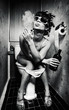 girl sits in a toilet