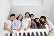 Low angle view of young friends smiling together