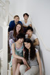 Group portrait of young friends sitting in stairway