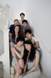 Group portrait of friends sitting in stairway