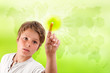 Boy touching futuristic green interface.
