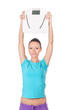 Happy woman holding  scale