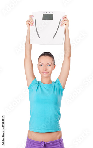 Foto: Happy woman holding scale Happy woman holding scale