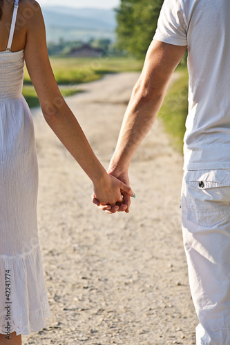 Photo: Couple holds hands Couple holds hands