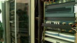 An engineer inspects the server in the server room