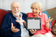 Photo: Senior Couple Confused by Tablet PC Senior Couple Confused by Tablet PC