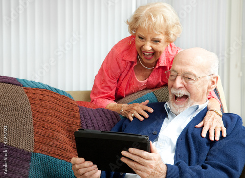 Photo: Tablet PC - Senior Couple Laughing Tablet PC - Senior Couple Laughing