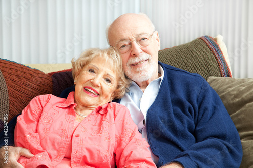 Photo: Senior Couple Relaxing on Couch Senior Couple Relaxing on Couch