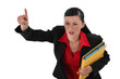 Angry businesswoman holding documents