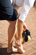 Woman in pain from wearing high heels