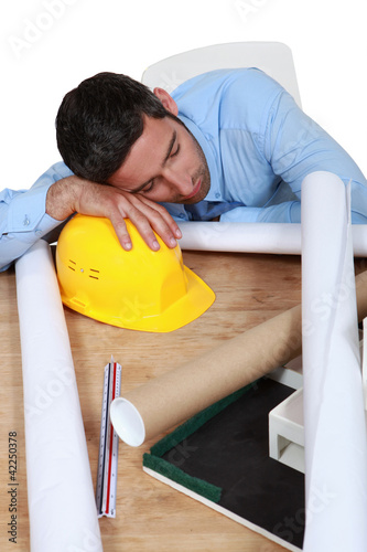 Photo: Architect sleeping on the job Architect sleeping on the job