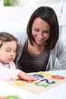 Woman playing with her child