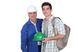 Construction worker and his apprentice