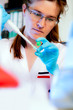 Photo: Portrait of a scientist with pipette Portrait of a scientist with pipette