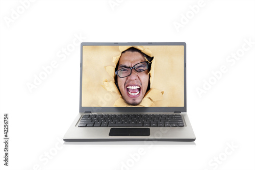 Photo: Angry man on the laptop Angry man on the laptop