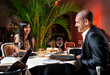 Foto: Beautiful couple at restaurant on romantic date Beautiful couple at restaurant on romantic date