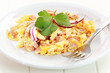 Scrambled eggs with ham and onion