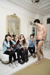 Male stripper performing in front of young females