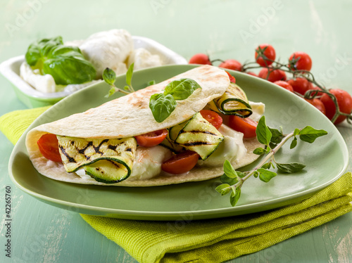 Foto: piadina with mozzarella, grilled zucchinis and tomatoes piadina with mozzarella, grilled zucchinis and tomatoes