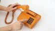 Video: Woman is pressing the buttons of old orange telephone Woman is pressing the buttons of old orange telephone