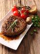 close-up of juicy beef steak covered with pepper  and salt