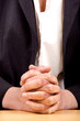 Foto: woman holding hands folded for prayer woman holding hands folded for prayer