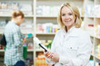 Foto: Pharmacy chemist woman in drugstore Pharmacy chemist woman in drugstore