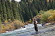 Fisherman fly fishing