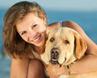 Girl embracing her dog
