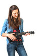 Foto: Teen playing ukulele Teen playing ukulele