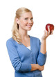Photo: Smiling attractive woman offers a red apple, isolated Smiling attractive woman offers a red apple, isolated
