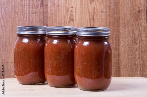 Photo: Three jars of homemade tomato sauce Three jars of homemade tomato sauce