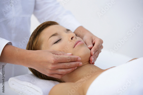 Photo: Woman having face massage Woman having face massage