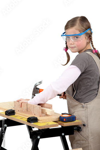 Photo: schoolgirl disguised as carpenter schoolgirl disguised as carpenter