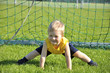 Young boy or kid plays soccer or football sports for exercise an