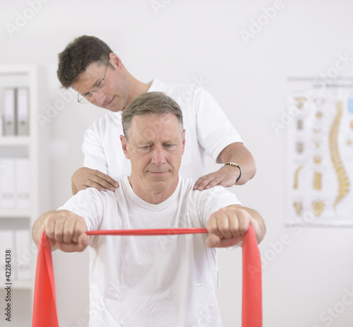 Photo: Physiotherapy: Senior man and physiotherapist Physiotherapy: Senior man and physiotherapist