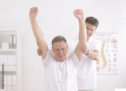 Photo: Physiotherapy: Senior man and physiotherapist Physiotherapy: Senior man and physiotherapist