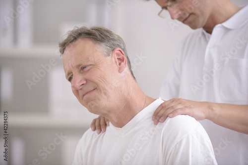 Photo: Physiotherapy: Physiotherapist massaging patient Physiotherapy: Physiotherapist massaging patient