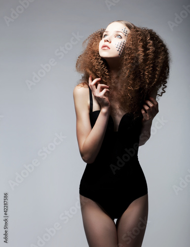 Photo: Redhead girl in retro lingerie. Sexy lady with stylish hairstyle Redhead girl in retro lingerie. Sexy lady with stylish hairstyle