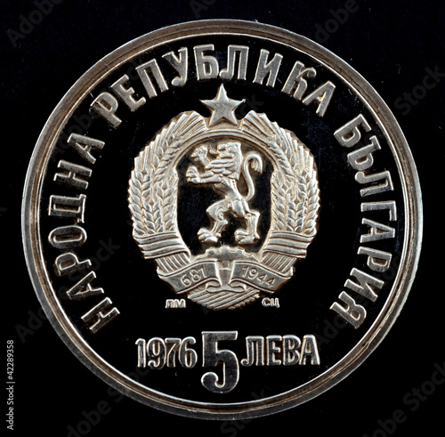 Photo: Commemorative coin lev from Bulgaria on a black background Commemorative coin lev from Bulgaria on a black background