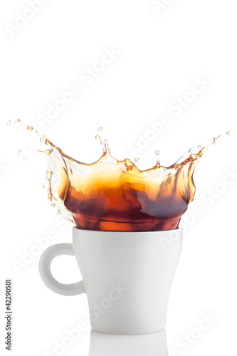Photo: Splash of coffee in white cup Splash of coffee in white cup