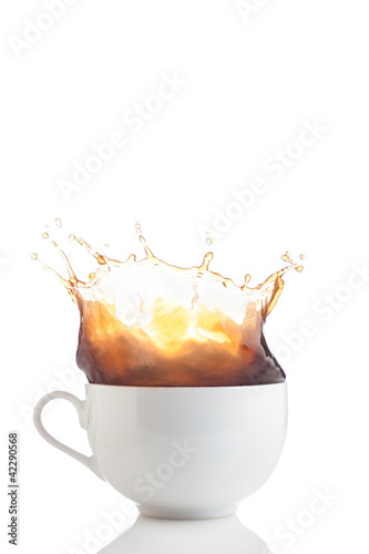 Photo: Splash of coffee in white cup Splash of coffee in white cup