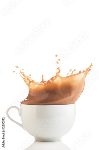 Photo: Splash of coffee in white cup Splash of coffee in white cup