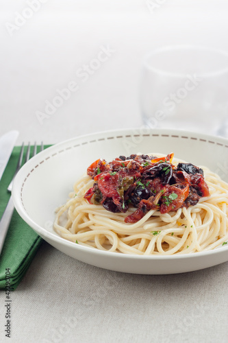 Photo: plate of spaghetti a la putanesca plate of spaghetti a la putanesca