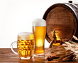 Beer barrel with beer glasses on a wooden table.